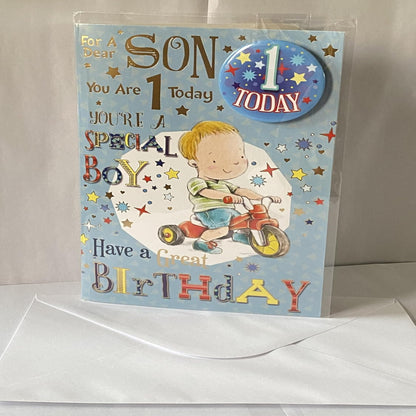 Son 1st Birthday Card – Cute Boy & Trike Design with Badge  -  22cm  x  15cm